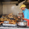 Grilling chickens at local Sunday Market