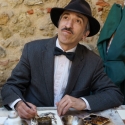 Artist painting with coffee in Lisbon
