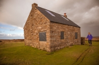 Walker by Trough house, an old shooting lodge on North Yorkshire National Park