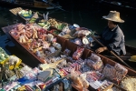 Lady selling goods at Damnoen Saduak Floating market Ratchaburi province Thailand Far East Asia